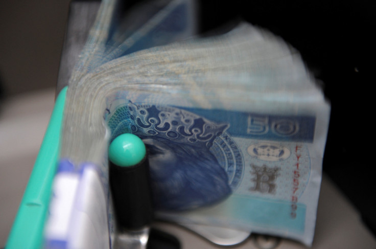 Machine checks authenticity of Polish Zloty at the National Bank of Poland building in Warsaw