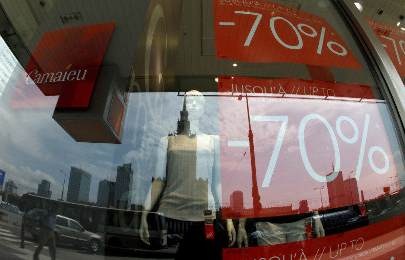 The Palace of culture is reflected in the window of a shop with sales up to 70 percent of in the centre of Warsaw