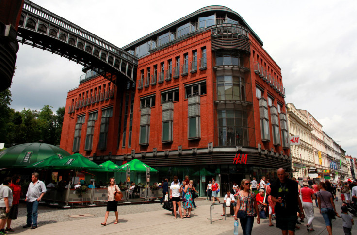 People walk near Stary Browar shopping centre in Poznan