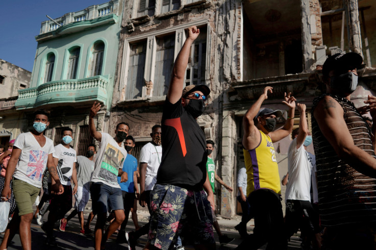 People shout slogans against the government during a protest in Havana