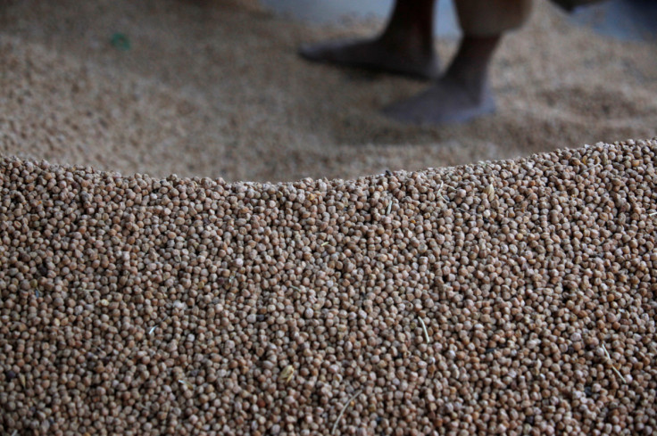 A mound of chickpeas is seen as they are packaged to sell at a wholesale market in Karachi