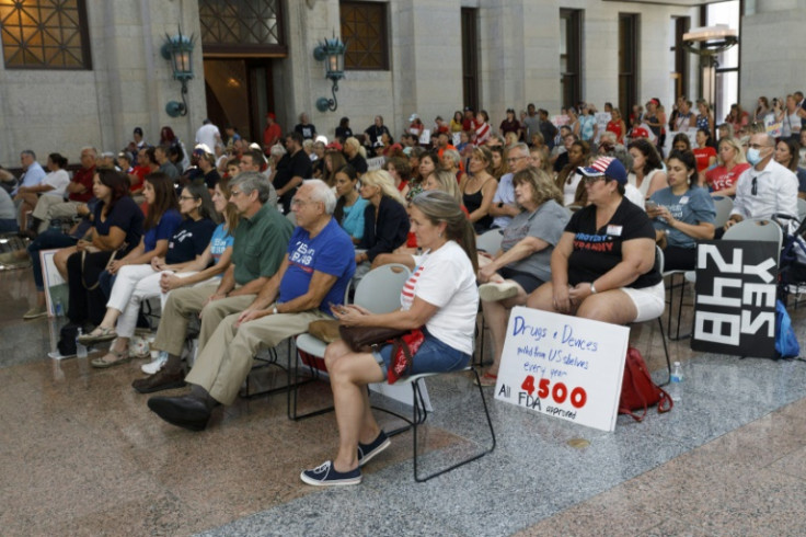Anti-vaccine mandate protesters listen as testimony is given at the Ohio Statehouse last year