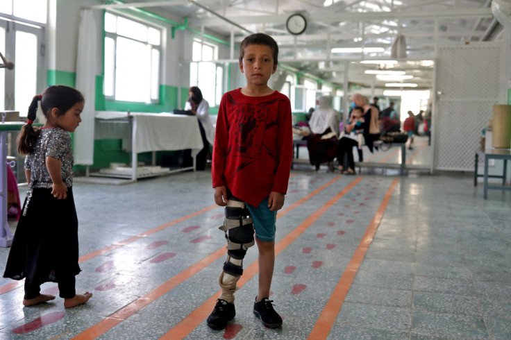 Idris poses for a photograph at the Red Cross rehabilitation center in Kabul