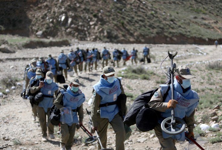 Members of a demining organisation are seen after their search for unexploded ordnance in Khaki Jabbar district of Kabul province