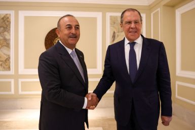 Russian Foreign Minister Sergei Lavrov and Turkish Foreign Minister Mevlut Cavusoglu meet in Denpasar