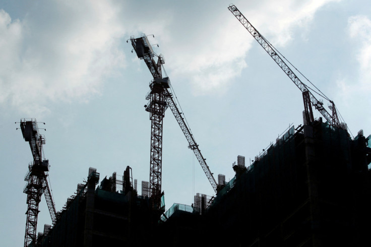 Workers work at the construction site of a new apartment in Jakarta