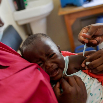 A nurse administers the malaria vaccine to an infant at the Lumumba hospital in Kisumu