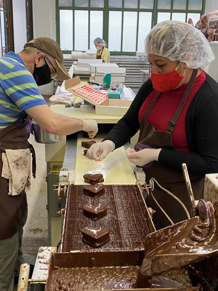 Workers process sweets at Li-Lac Chocolates in the Brooklyn borough of New York City