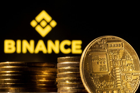 Illustration shows a representation of cryptocurrency and Binance logo