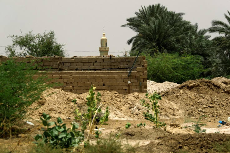 Gold mining residues are seen piled up near a residential area in the village of Banat in River Nile state, north of the Sudanese capital Khartoum. Sudan is one of the world's poorest countries, and gold mining remains a source of fast profits