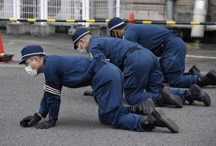 Investigators work at the scene of former Japanese Prime Minister Shinzo Abe's assassination, in Nara, Japan