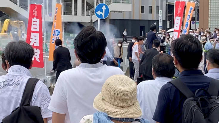 A general view shows the first moment when a gunfire is shot while former Japanese PM Shinzo Abe speaks during an election campaign in Nara