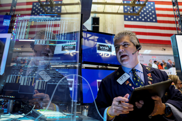 Traders work on the floor of the NYSE in New York