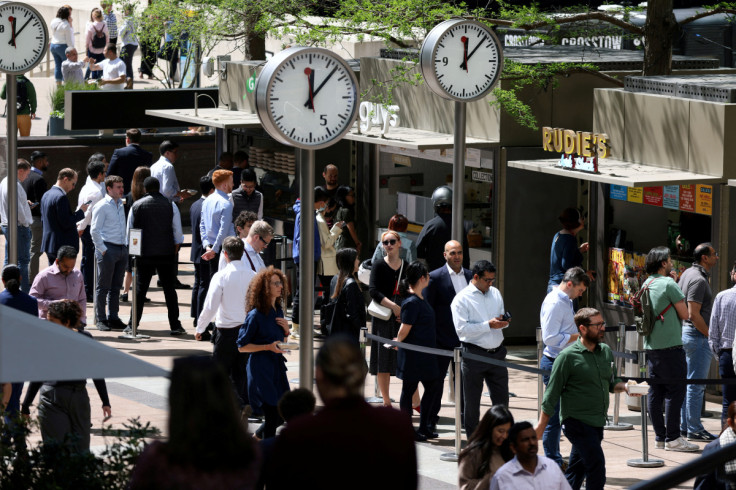 People queue for food in the financial district of Canary Wharf