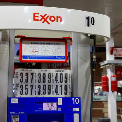 Signage is seen on a gasoline pump at an Exxon gas station in Brooklyn, New York City