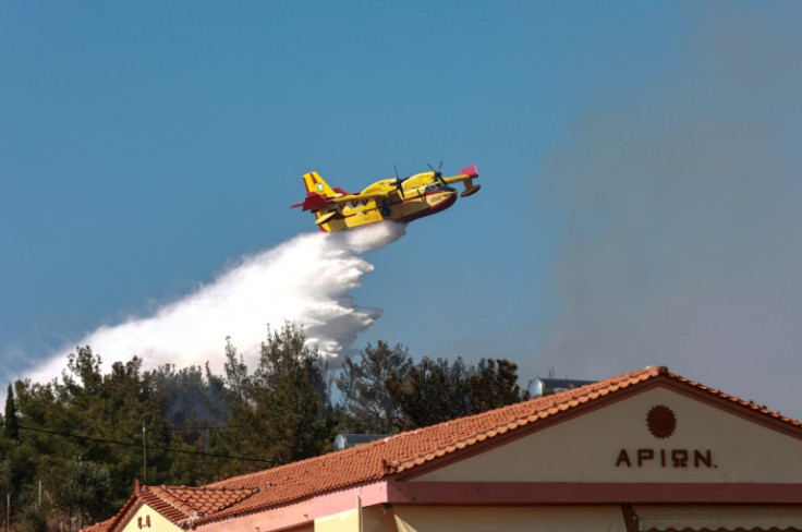 Dozens of firefighters are battling the blaze on Lesbos