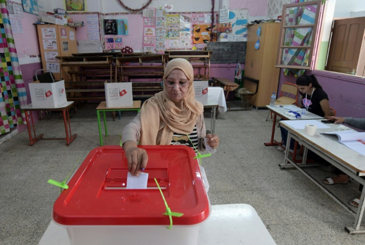 A Tunisian votes in a referendum on the constitution at a polling station in the capital Tunis, on July 25, 2022