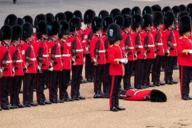 A member of the Coldstream Guards succumbs to the heat, June 2022.
