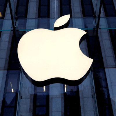 The Apple Inc logo is seen hanging at the entrance to the Apple store on 5th Avenue in New York