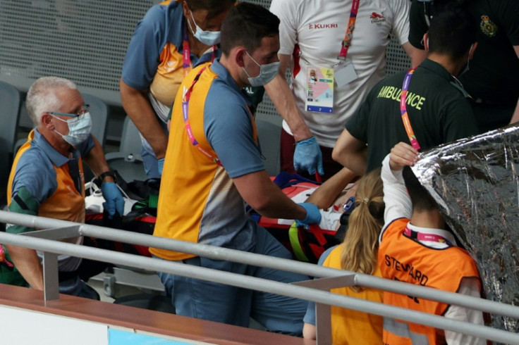 England's Matt Walls is carried on a stretcher after suffering an injury during the Commonwealth Games track cycling