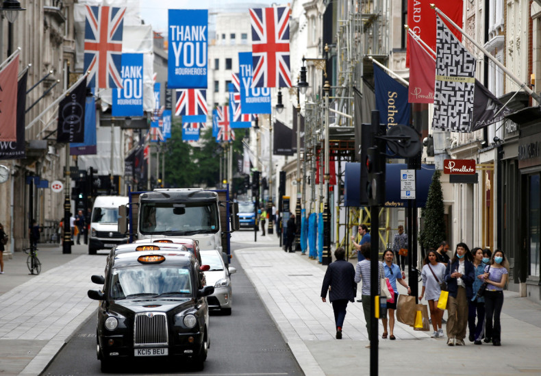 People walk along New Bond Street in London