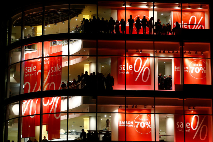 Customers and employees of a shopping mall watch the demonstrations of supporters of the movement of Patriotic Europeans Against the Islamisation of the West (PEGIDA) and their opponents in Frankfurt