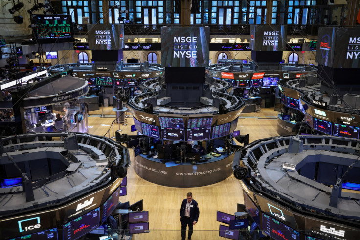 A trader walks on the trading floor at the New York Stock Exchange (NYSE) in Manhattan, New York City