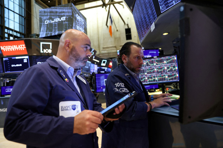 Traders work on the trading floor at the New York Stock Exchange (NYSE) in Manhattan, New York City