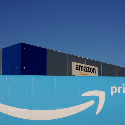 The logo of Amazon Prime Delivery is seen on the trailer of a truck outside the company logistics center in Lauwin-Planque