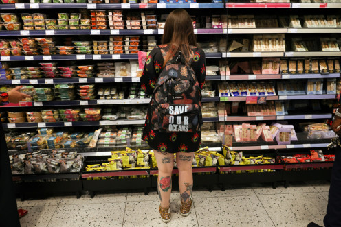 A person looks at food goods in a shop in London