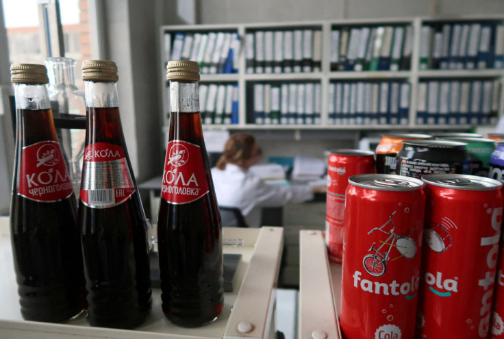 A view shows bottles and cans of soft drinks at a plant of the Chernogolovka company in Moscow Region