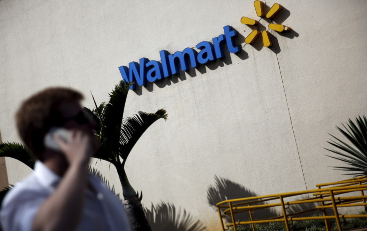 A man talks on his mobile phone in front of a Walmart store in Sao Paulo