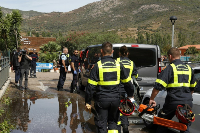 Rescue workers at a campground in Coggia, Corsica, where a 13-year-old girl was killed Thursday when a tree fell on her bungalow