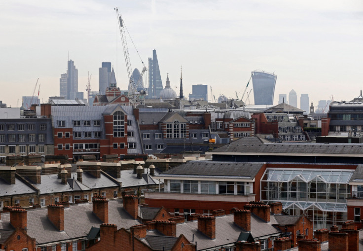 The skyline of the City of London and the Canary Wharf financial district is seen in London