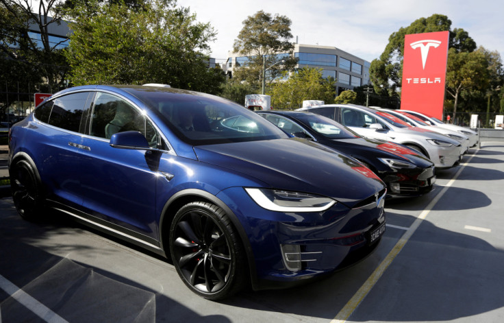 A Tesla Model X car (front) and Model S (2nd L) are photographed at a Tesla electric car dealership in Sydney