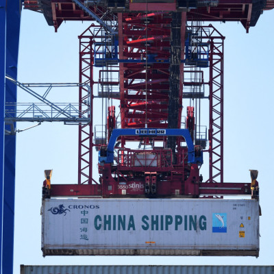 A container of China Shipping is loaded at a loading terminal in the port of Hamburg