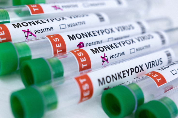 Illustration shows test tubes labelled "Monkeypox virus positive and negative