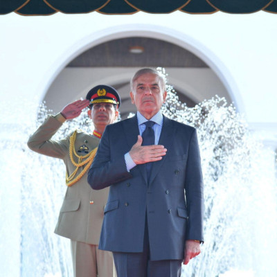 Pakistan's Prime Minister Shehbaz Sharif gestures during the guard of honour ceremony at the prime minister house in Islamabad