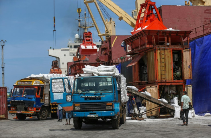 Trucks carrying fertiliser arrive at a port in Colombo. Sri Lanka has been experiencing acute shortages of a range of goods
