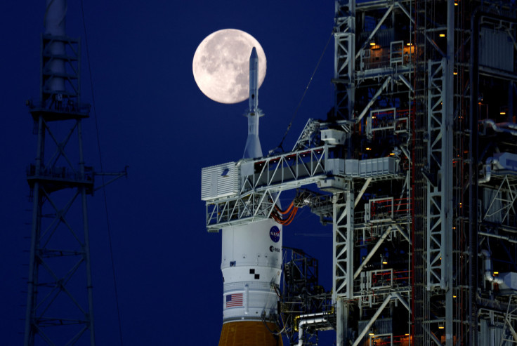 A full moon, known as the "Strawberry Moon" is shown with NASA’s next-generation moon rocket, the Space Launch System (SLS) Artemis 1, at the Kennedy Space Center in Cape Canaveral