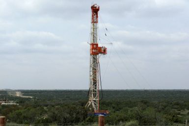 A rig contracted by Apache Corp drills a horizontal well in a search for oil and natural gas in the Permian Basin in West Texas