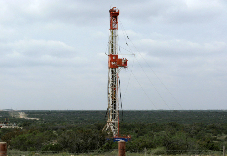 A rig contracted by Apache Corp drills a horizontal well in a search for oil and natural gas in the Permian Basin in West Texas