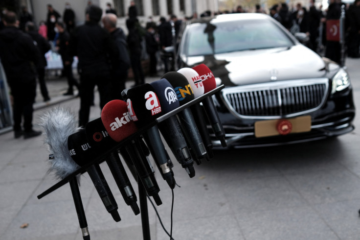 Media microphones are pictured next to the car of Turkish President Erdogan, in Istanbul