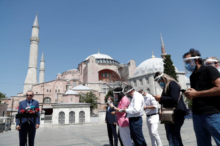 Turkish President Tayyip Erdogan talks to media after attending Friday prayers at Hagia Sophia Grand Mosque, in Istanbul