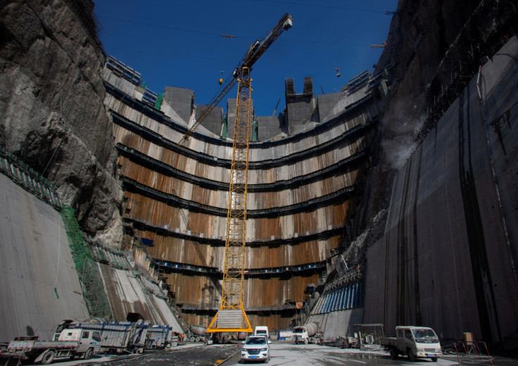 Crane is seen near the dam of Wudongde hydropower plant under construction, on the Jinsha River