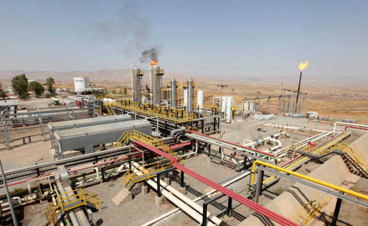 A flame rises from a chimney at Taq Taq oilfield in Erbil