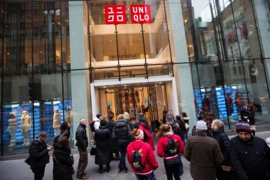 Shoppers line up to wait for the opening of a Uniqlo store in New York
