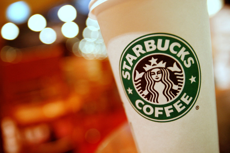 A cup of Starbucks coffee sits on a table in a cafe in central Hong Kong