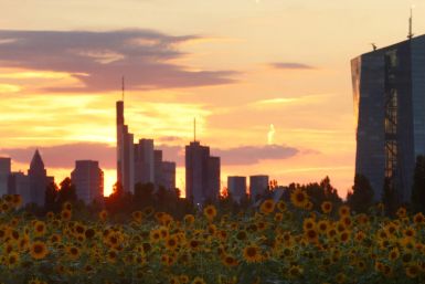 The sun sets behind the skyline of Frankfurt