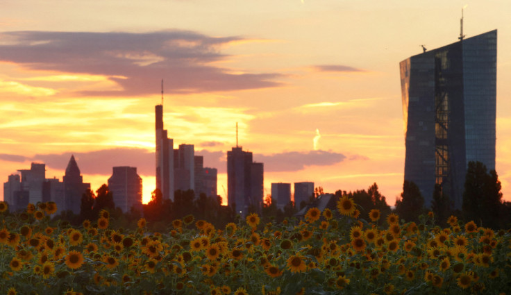 The sun sets behind the skyline of Frankfurt